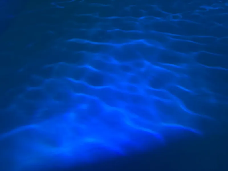 a pool with blue water is shown from above